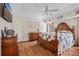 Comfortable main bedroom with hardwood floors, natural light, and nautical decor at 2455 Jacoby Cir, North Port, FL 34288
