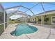 A beautiful screened-in pool and patio area, ideal for enjoying sunny days outdoors at 2455 Jacoby Cir, North Port, FL 34288
