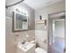 Bathroom featuring white tiled walls and vanity at 2513 Ambrose Ln, Port Charlotte, FL 33952