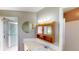 Bathroom features include built-in vanity storage, a sink, and a tiled shower at 2513 Ambrose Ln, Port Charlotte, FL 33952