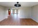 Spacious living room featuring wood floors and arched doorway at 2513 Ambrose Ln, Port Charlotte, FL 33952