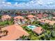 An aerial view of a residential area, showcasing a home along a canal with access to serene waterways, manicured lawns at 2630 Tarpon Cove Dr # 211, Punta Gorda, FL 33950