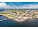 Beautiful aerial view showcases the waterfront community, palm trees, and nearby marina at 2630 Tarpon Cove Dr # 211, Punta Gorda, FL 33950