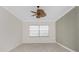Spacious bedroom features wood flooring, natural light and ceiling fan at 2630 Tarpon Cove Dr # 211, Punta Gorda, FL 33950