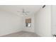 Well lit bedroom with a ceiling fan and light wood-look flooring at 2630 Tarpon Cove Dr # 211, Punta Gorda, FL 33950