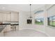 Bright dining nook connects to the kitchen and has many windows at 2630 Tarpon Cove Dr # 211, Punta Gorda, FL 33950