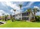 Well-manicured lawn with lush foliage and private waterfront access with boat docks at 2630 Tarpon Cove Dr # 211, Punta Gorda, FL 33950