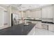 Kitchen with stainless steel appliances, breakfast bar and cooktop at 2630 Tarpon Cove Dr # 211, Punta Gorda, FL 33950