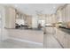 Large kitchen with granite countertops, stainless steel appliances, and custom cabinetry at 2630 Tarpon Cove Dr # 211, Punta Gorda, FL 33950