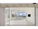 Bright lanai with tile floor and large sliding glass doors offering serene waterfront views at 2630 Tarpon Cove Dr # 211, Punta Gorda, FL 33950