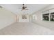 Bright living room with tile floors, a ceiling fan, and bar area at 2630 Tarpon Cove Dr # 211, Punta Gorda, FL 33950