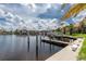 Picturesque waterfront featuring well-maintained docks, lush greenery, and beautiful waterfront residences at 2630 Tarpon Cove Dr # 211, Punta Gorda, FL 33950