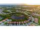 An aerial view of single-Gathering homes in a mature planned community with ponds and winding streets at 2712 Arugula Dr, North Port, FL 34289