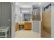 Ensuite bathroom with tile floors, a glass-enclosed shower, and vanity at 2712 Arugula Dr, North Port, FL 34289