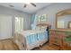 Comfortable bedroom featuring coastal-themed decor, wood floors, and ample natural light at 2712 Arugula Dr, North Port, FL 34289