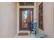 A charming front door with glass, decorative elements, and a 'Welcome' mat at 2712 Arugula Dr, North Port, FL 34289