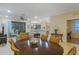 Spacious living area seamlessly connects to kitchen and outdoor patio, ideal for modern living at 2712 Arugula Dr, North Port, FL 34289