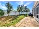 Spacious backyard with healthy grass, privacy fence, and brick patio at 27896 Arrowhead Cir, Punta Gorda, FL 33982