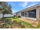 Well-maintained backyard with patio and lush greenery, perfect for outdoor enjoyment at 27896 Arrowhead Cir, Punta Gorda, FL 33982