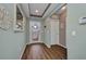 Welcoming foyer with hardwood floors, decorative mirror, and natural light at 27896 Arrowhead Cir, Punta Gorda, FL 33982