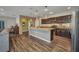Open kitchen featuring a large island and dark cabinetry at 27896 Arrowhead Cir, Punta Gorda, FL 33982