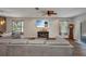 Open living room featuring a large sectional sofa and entertainment center at 27896 Arrowhead Cir, Punta Gorda, FL 33982