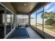 View of a screened in patio with seating, and access to the backyard at 27896 Arrowhead Cir, Punta Gorda, FL 33982