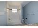 Bathroom featuring a tub and shower with tile surround, toilet, vanity, and granite counters at 3085 Arrowhead Rd, Venice, FL 34293