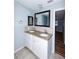 Updated bathroom features granite counters, double vanity, and modern fixtures at 3085 Arrowhead Rd, Venice, FL 34293