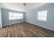 Bedroom featuring light-blue walls, hard surface floors, and bright, natural light at 3085 Arrowhead Rd, Venice, FL 34293
