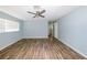 Bedroom featuring hard surface floors, a ceiling fan, and a window for natural light at 3085 Arrowhead Rd, Venice, FL 34293