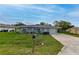 Well-maintained single-story home with a neat front yard and driveway at 3085 Arrowhead Rd, Venice, FL 34293