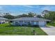 Charming single-story home featuring a well-manicured lawn and attached garage at 3085 Arrowhead Rd, Venice, FL 34293