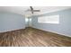 Spacious living room featuring laminate flooring, a ceiling fan, and a bright atmosphere with natural light at 3085 Arrowhead Rd, Venice, FL 34293