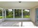 Covered patio featuring a serene backyard view and tile flooring at 3085 Arrowhead Rd, Venice, FL 34293