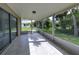 Screened in lanai offering backyard views and access to the outside at 3085 Arrowhead Rd, Venice, FL 34293
