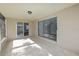 Enclosed patio with tile flooring and access to the backyard at 3085 Arrowhead Rd, Venice, FL 34293