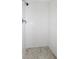 Shower featuring white subway tile and a gray stone tile floor at 3085 Arrowhead Rd, Venice, FL 34293