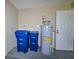 Utility room with water heater and new appliances at 3085 Arrowhead Rd, Venice, FL 34293