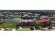 Waterfront community featuring luxury condos along a canal, beautiful landscaping, and a gorgeous view of the bay at 3308 Purple Martin Dr # 121, Punta Gorda, FL 33950