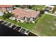 Waterfront condos with boat docks and a refreshing pool, surrounded by lush landscaping at 3308 Purple Martin Dr # 121, Punta Gorda, FL 33950
