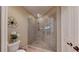 Updated bathroom features a glass shower enclosure, tiled walls, and tiled floors, with a white toilet at 3308 Purple Martin Dr # 121, Punta Gorda, FL 33950
