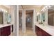 Luxurious bathroom with dual sinks, stylish tile flooring, a glass-enclosed shower at 3308 Purple Martin Dr # 121, Punta Gorda, FL 33950