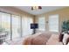 Cozy bedroom with sliding glass doors leading to a balcony, providing outdoor views at 3308 Purple Martin Dr # 121, Punta Gorda, FL 33950