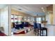 Light-filled dining space with a modern chandelier and windows that let in abundant natural light at 3308 Purple Martin Dr # 121, Punta Gorda, FL 33950