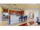 Modern kitchen with stainless steel appliances, sleek cherry cabinets, and granite countertops at 3308 Purple Martin Dr # 121, Punta Gorda, FL 33950