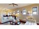 Cozy living room with comfortable seating, accent lighting, and a view of the dining area at 3308 Purple Martin Dr # 121, Punta Gorda, FL 33950