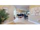 Inviting open-concept living area with tile flooring, dining area and bar seating for casual dining at 3308 Purple Martin Dr # 121, Punta Gorda, FL 33950