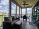 Screened patio has comfortable seating, a ceiling fan, a lake view, and lots of sunshine at 3308 Purple Martin Dr # 121, Punta Gorda, FL 33950