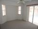 Bright bedroom with natural light, fan and glass doors leading to the pool at 388 Orlando Blvd, Port Charlotte, FL 33954